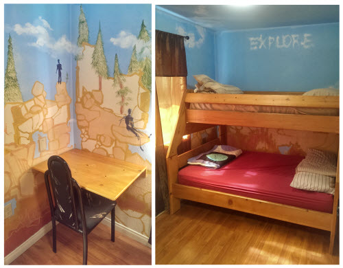 ADA Room showing bunk bed, accessible desk, murals on wall, window